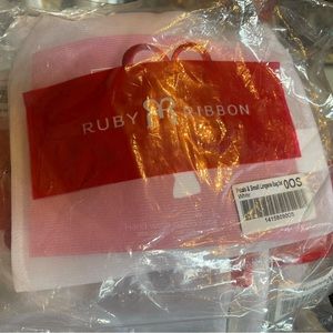 Unopened bag of Ruby Ribbon 6 pack of Petals(tan) and small lingerie bag(white)